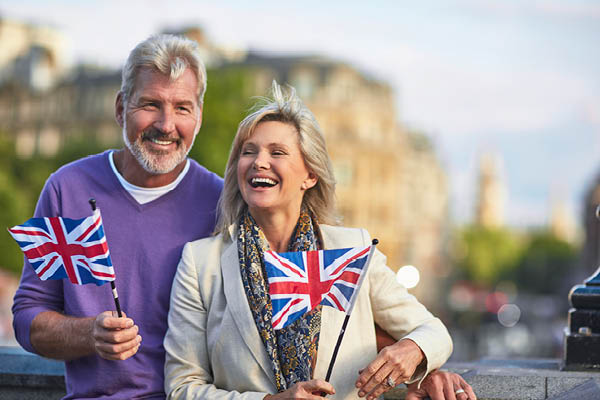 Couple smiling with flags