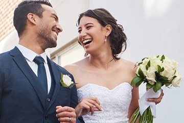 Smiling couple with flowers