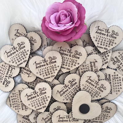 Wooden hearts with a a date carved on and a magnet on the back.