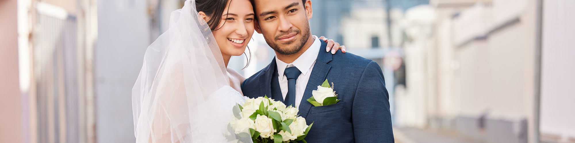 Smiling married couple on the street