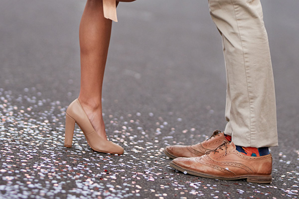 Wedding couple lower half showing brown shoes