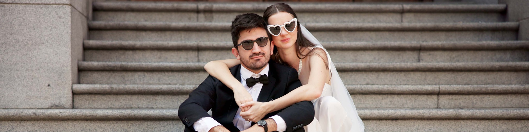 Wedding couple sitting on stairs